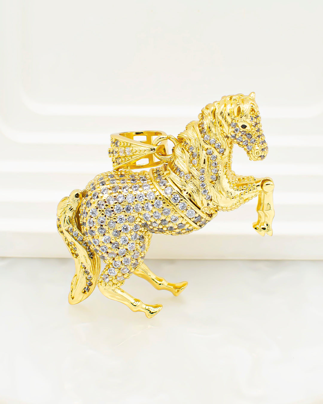 Dije caballo articulado