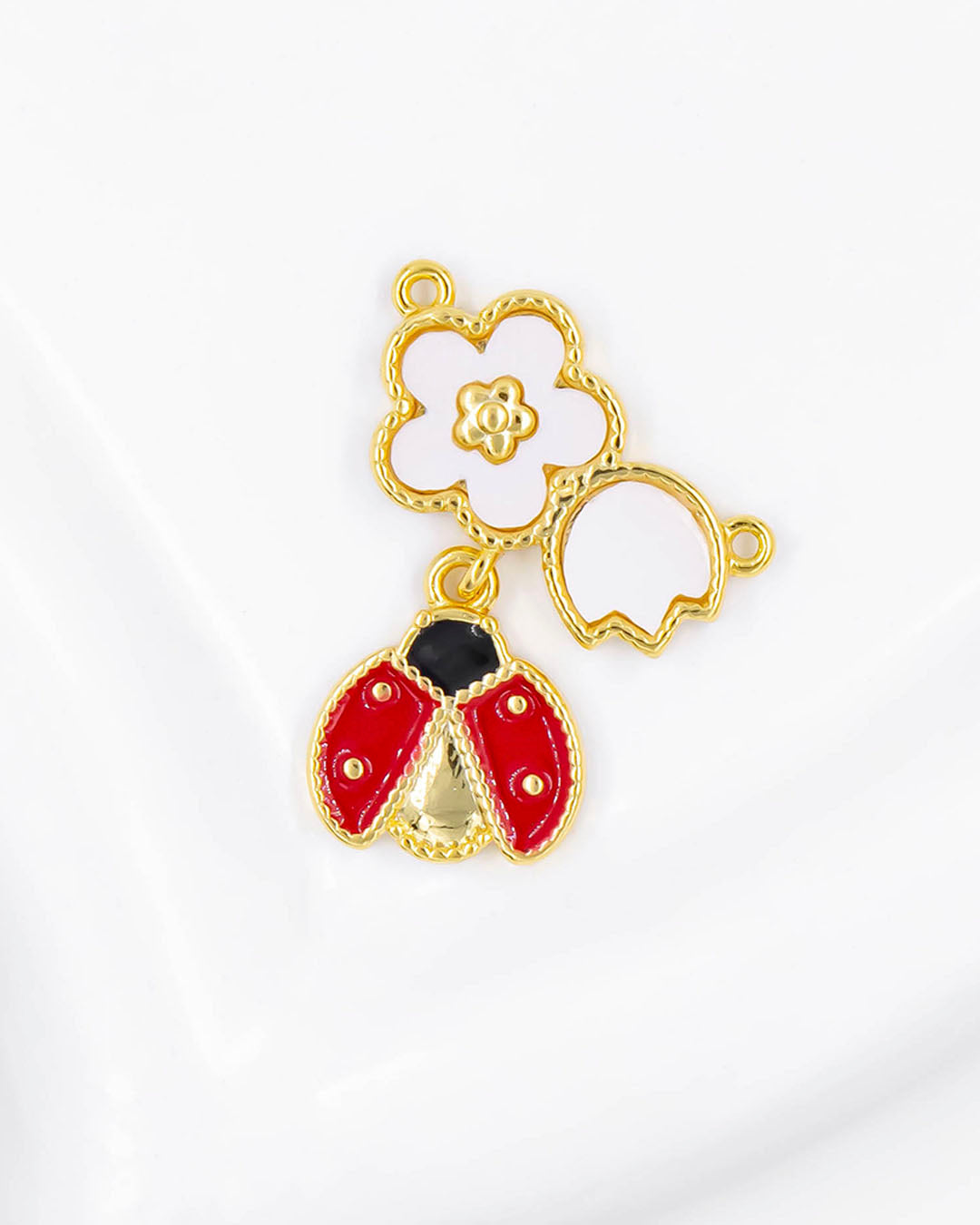 Dije de pulsera flor y mariquita