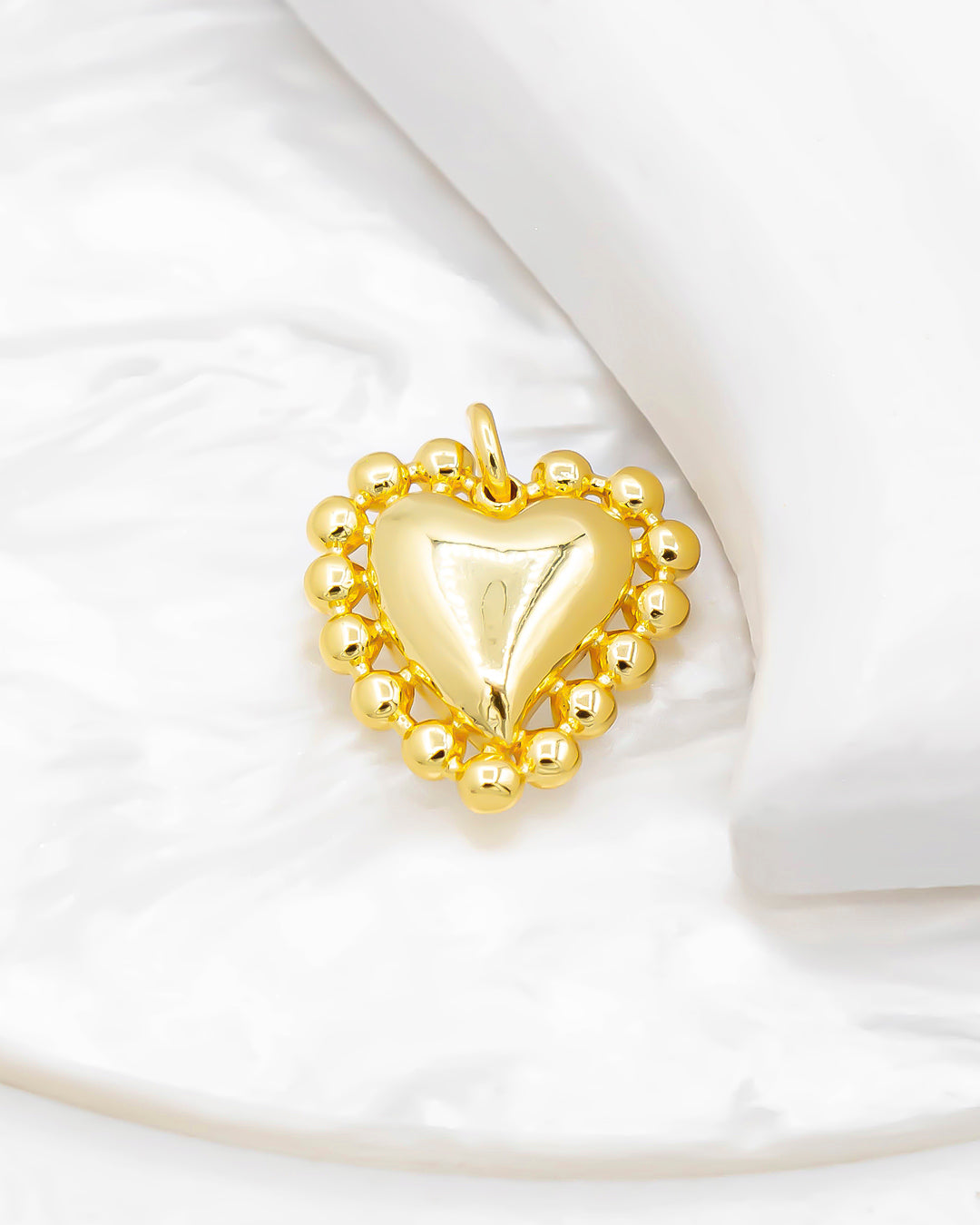 Dije corazón borde balines