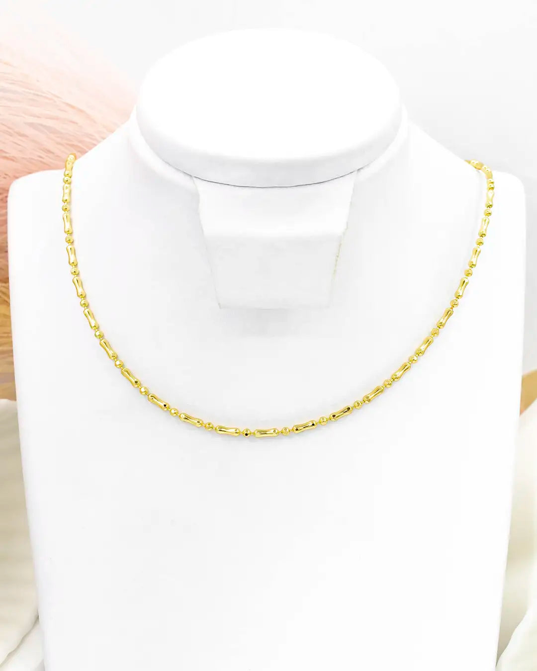 Cadena bolita palito