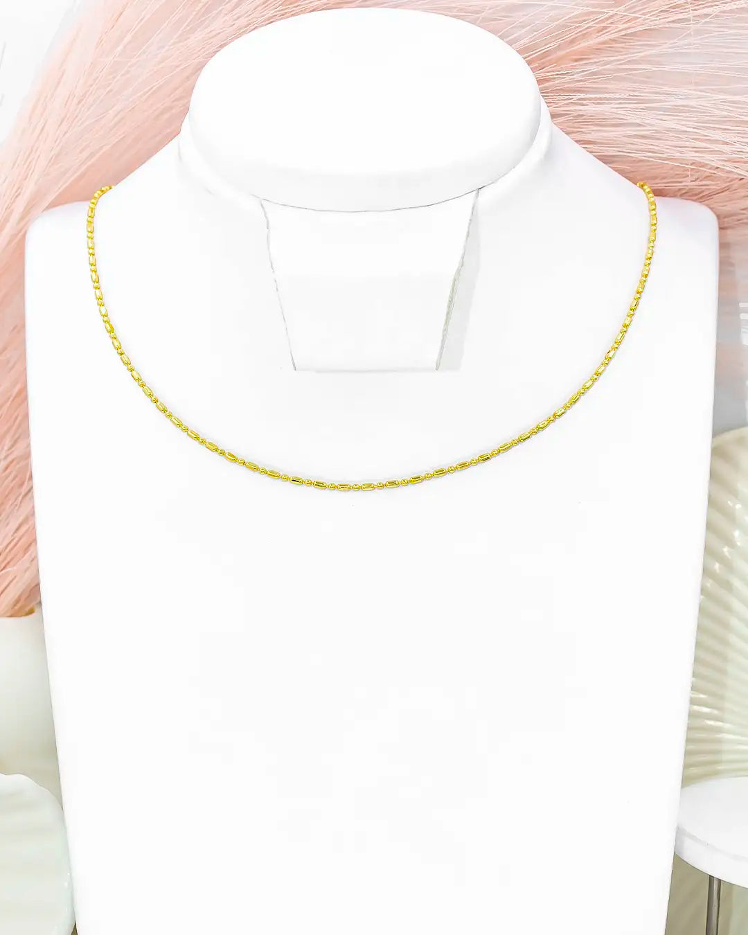 Cadena bolita palito