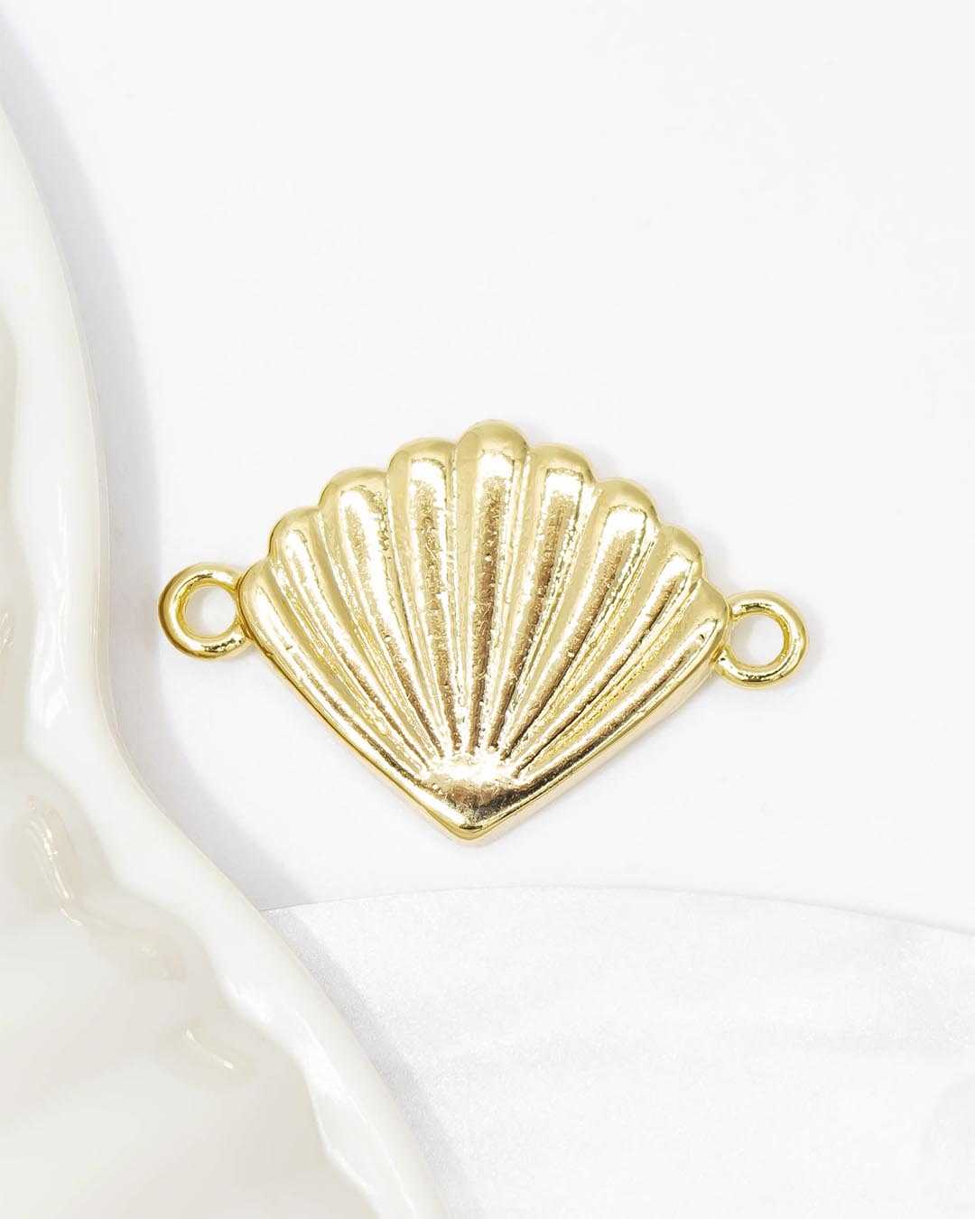 Dije pulsera concha