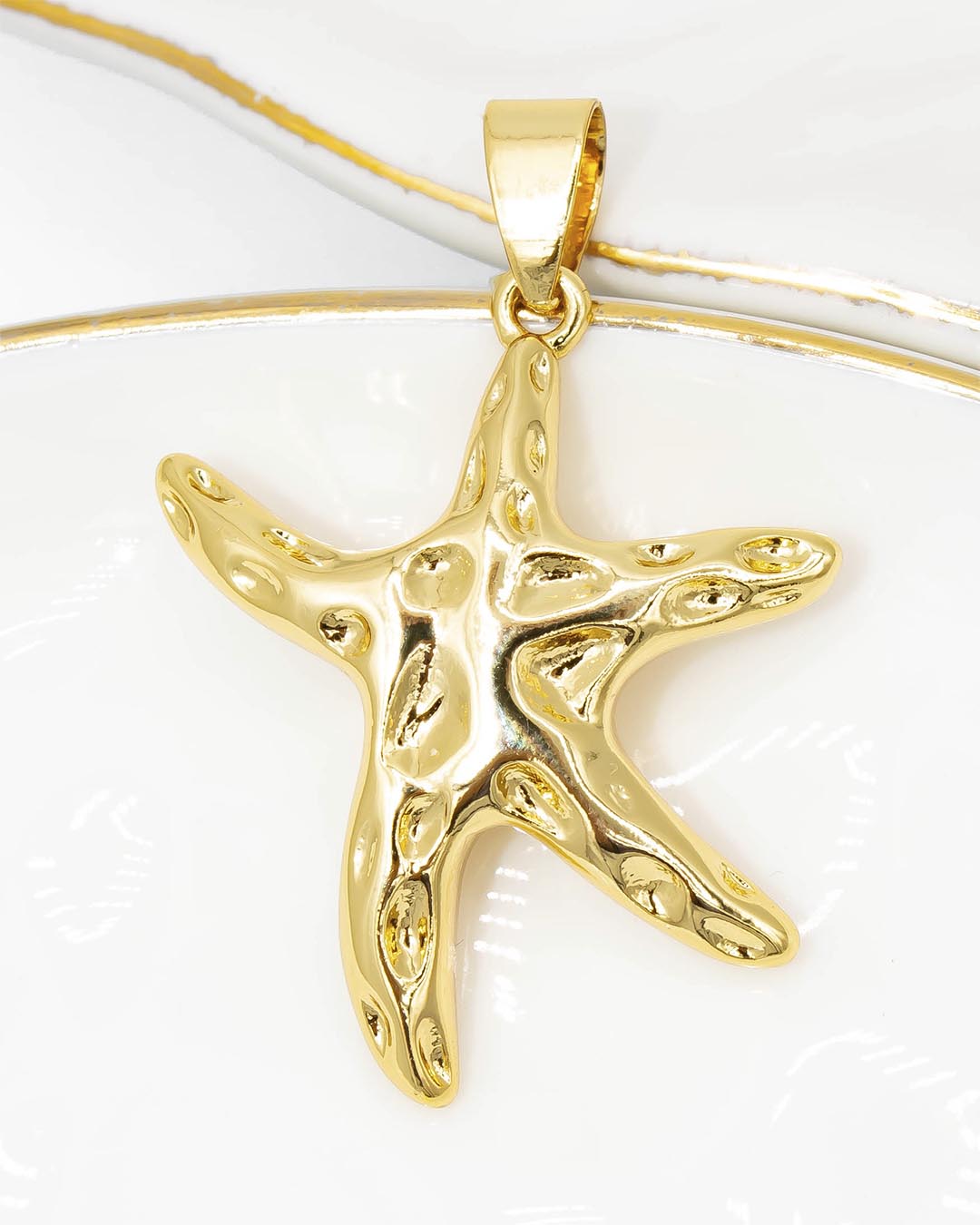 Dije estrella de mar dorada