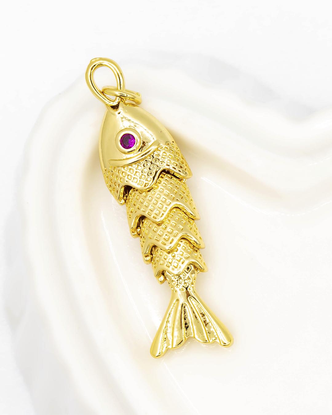 Dije pescado articulado