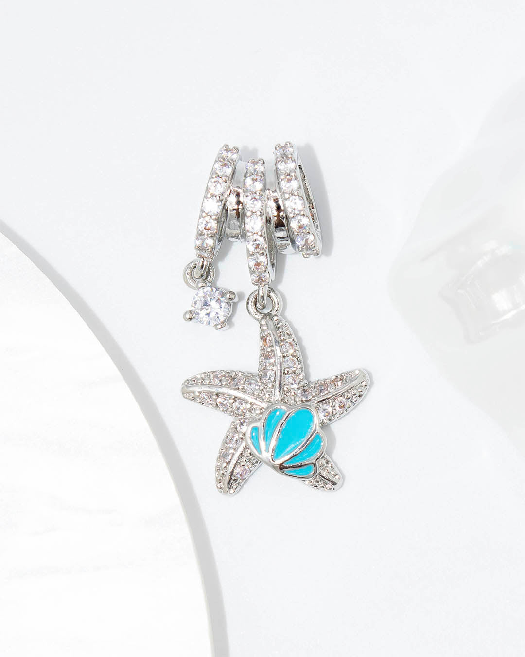 Dije estrella de mar y concha azul