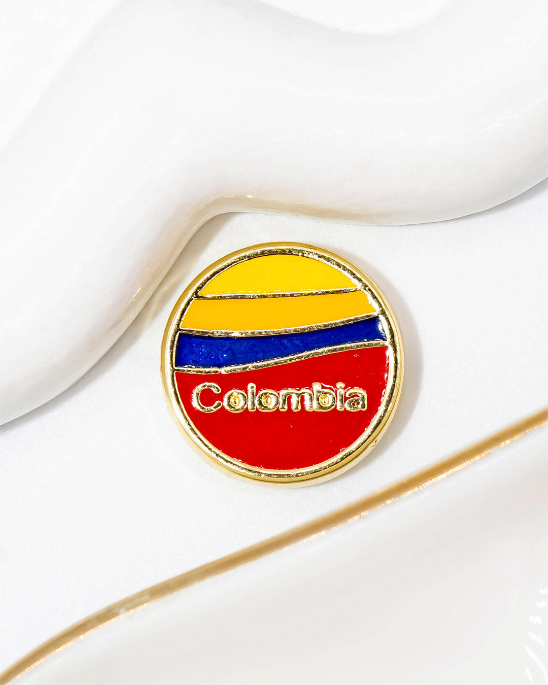 Dije Colombia pasador