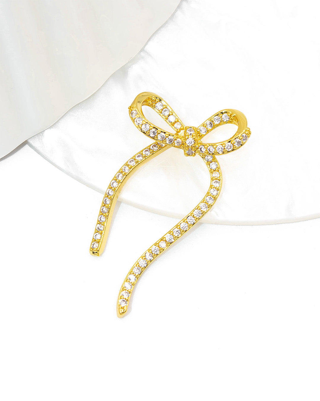 Dije moño articulado