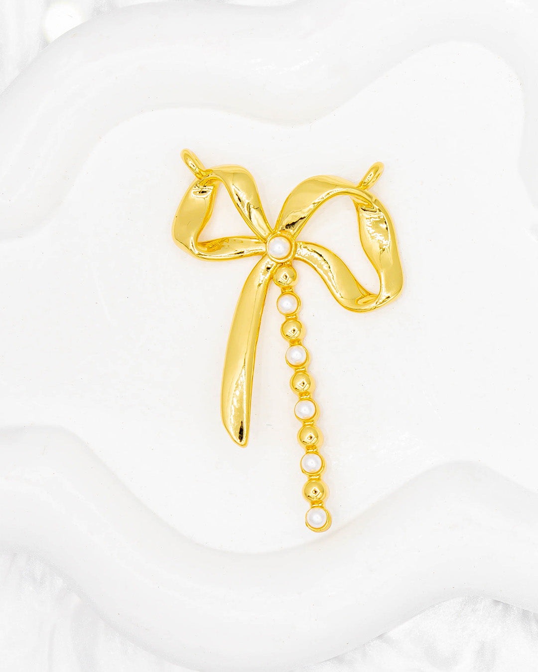 Dije moño doble argolla