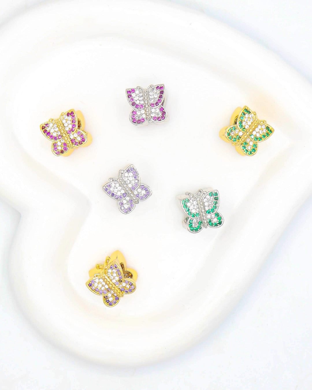 Dije pasador mariposa