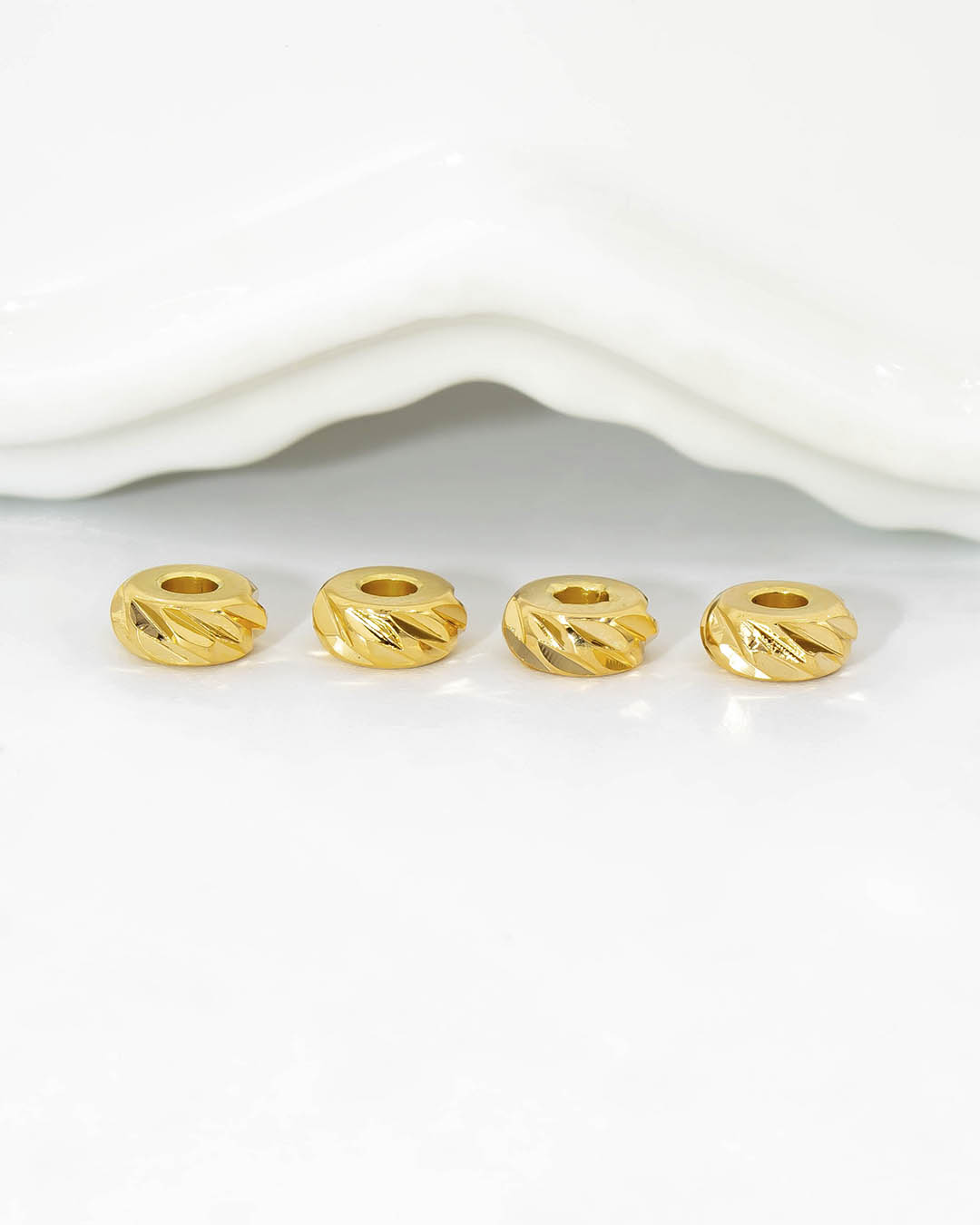 Oro laminado separador dona diamantada