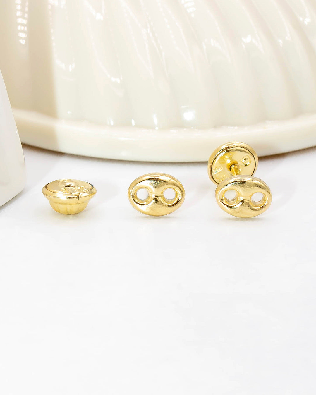 Oro laminado topo gucci