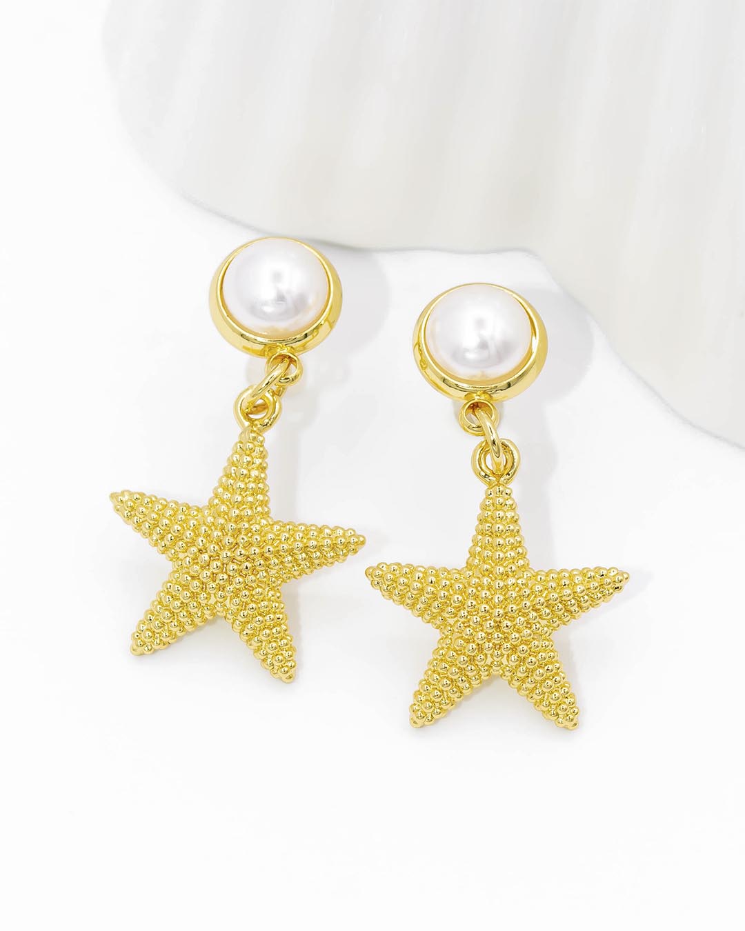 Topo estrella con perla