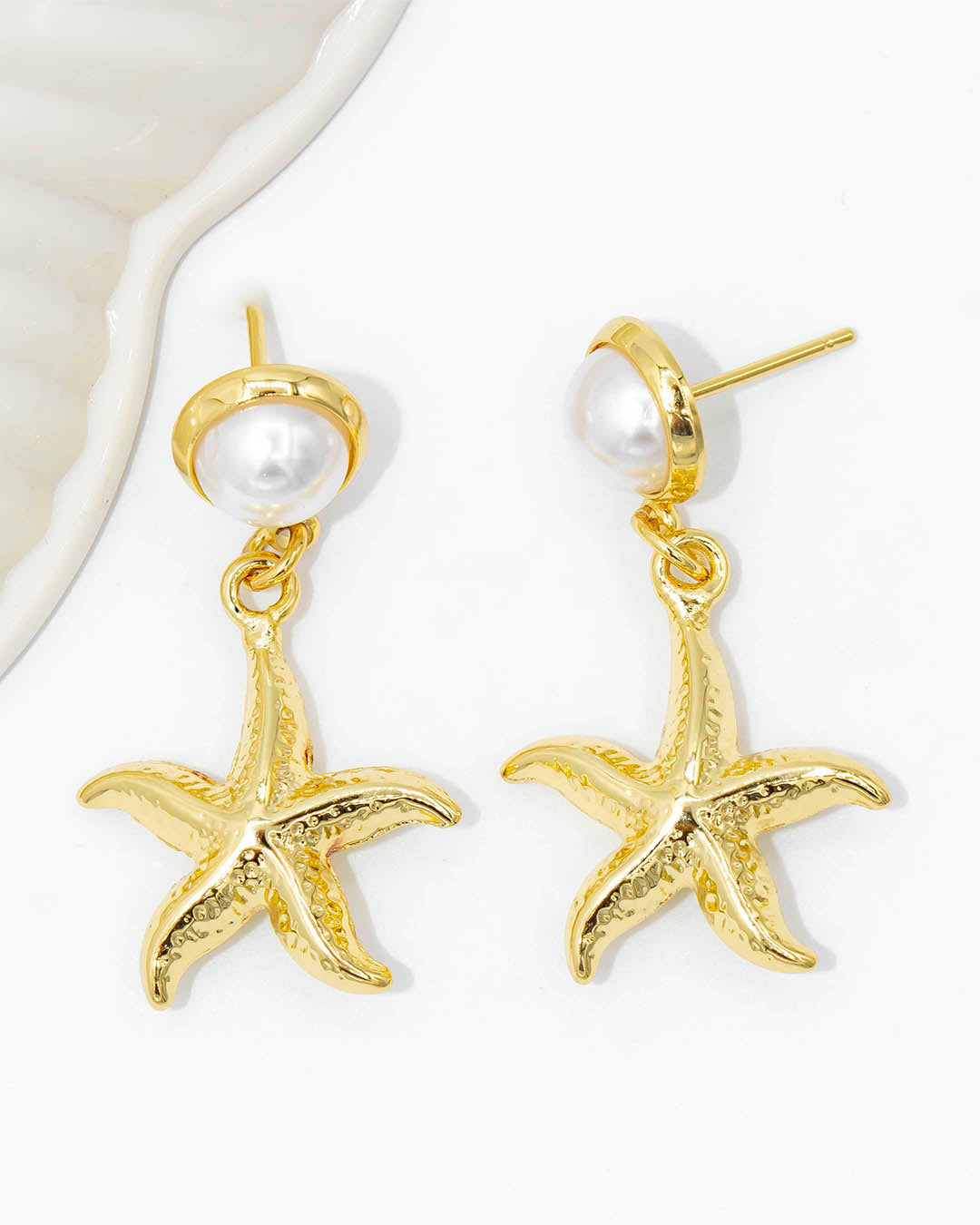 Topo perla estrella colgante