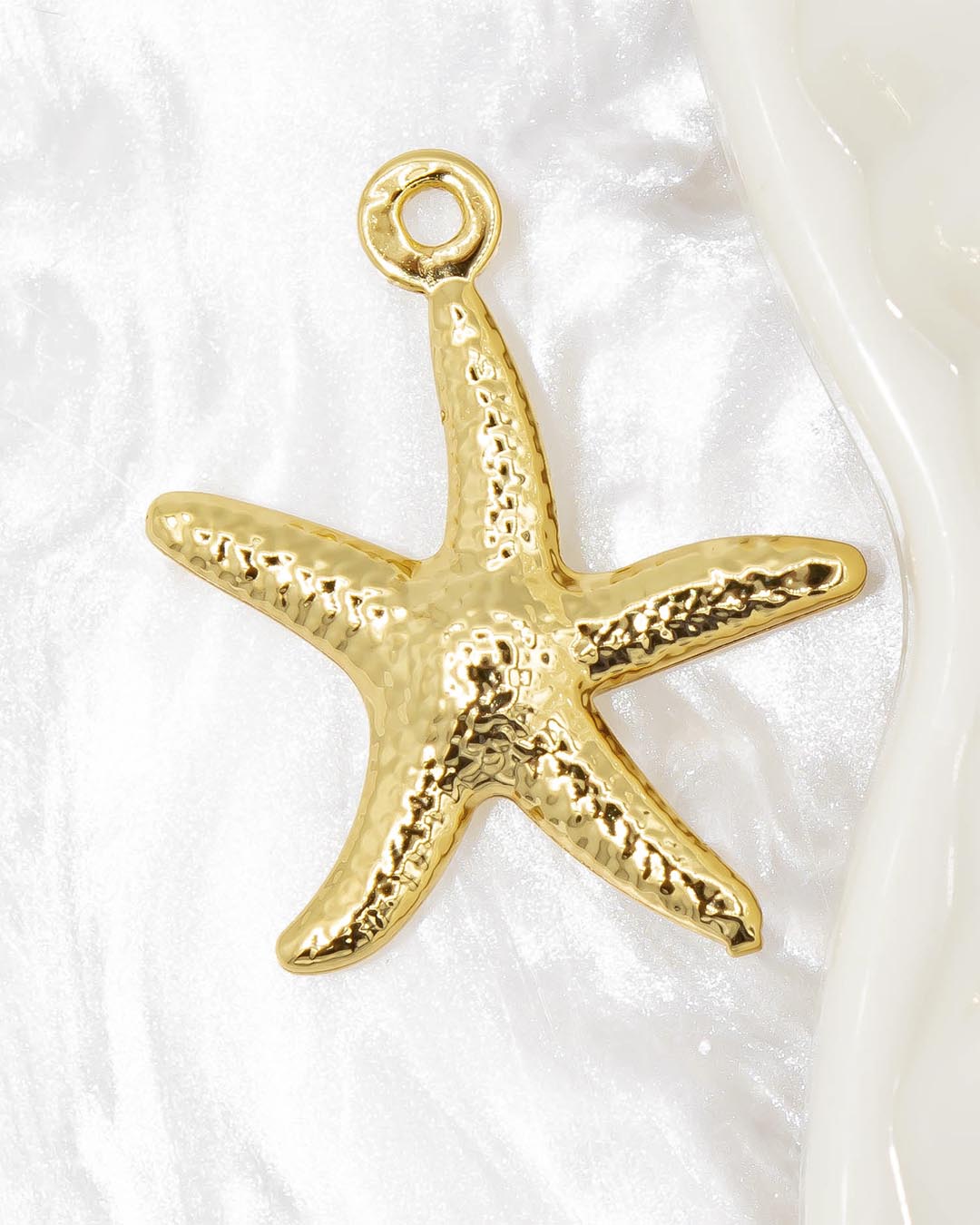 Dije estrella de mar dorada