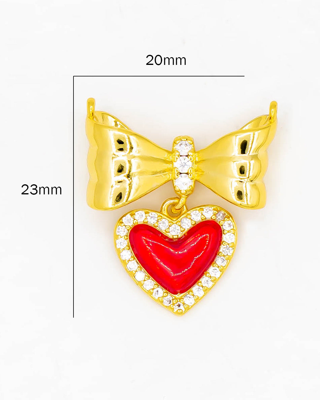 Dije moño con corazón