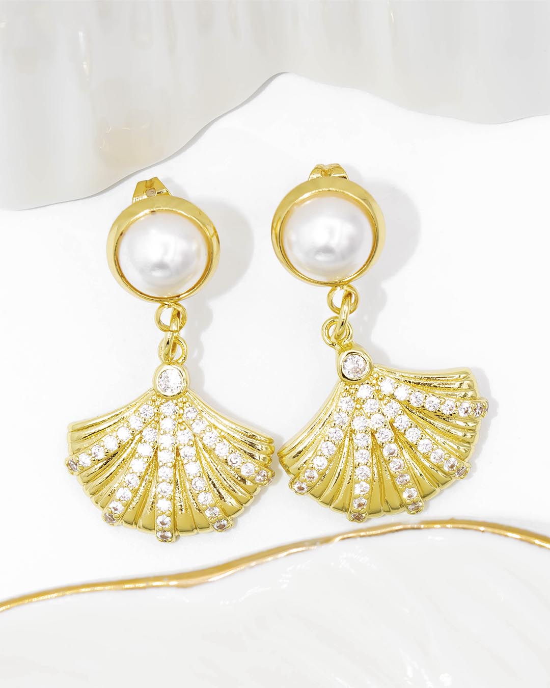 Topo concha con perla